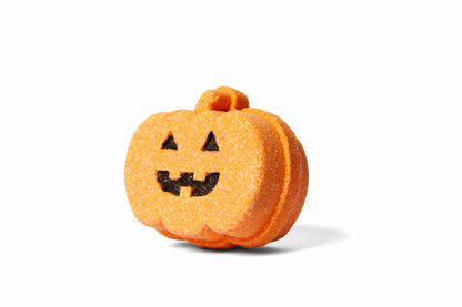 Pumpkin-shaped Jack 'o Lantern bath bomb or bath fizzer from the side.