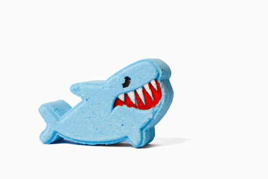 Blue shark-shaped bath bomb or bath fizzer from front.